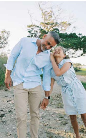 Martin Pyszczymuka leaning in to share a laugh with his daughter Amelia